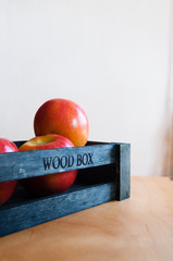 Delicious apples in a wooden box