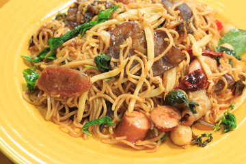 Sausage spaghetti on a wooden table