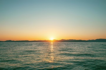 Obraz premium Sunset on Corfu Island in Ionian sea. Greece.