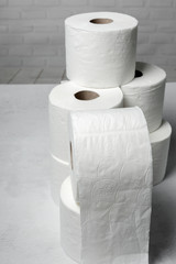White rolls of toilet paper with white background