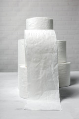 White rolls of toilet paper with white background