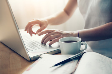 Hand holding credit card and and makes online shopping, work from home