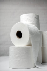 White rolls of toilet paper with white background
