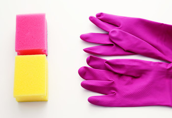 Purple gloves colored sponges for cleaning on a white background.