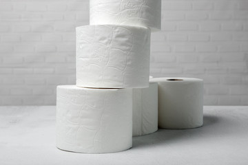 White rolls of toilet paper with white background