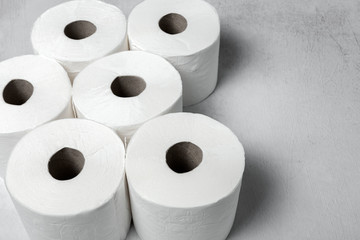 White rolls of toilet paper with white background
