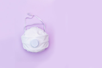 White medical mask on color background. A protection against pollution, virus, flu and coronavirus