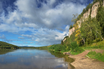 Obraz premium Ural mountains in the northern ridge. Rocks and rocky rifts on a mountain river in autumn