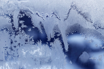 Winter window glass with beautiful ice pattern
