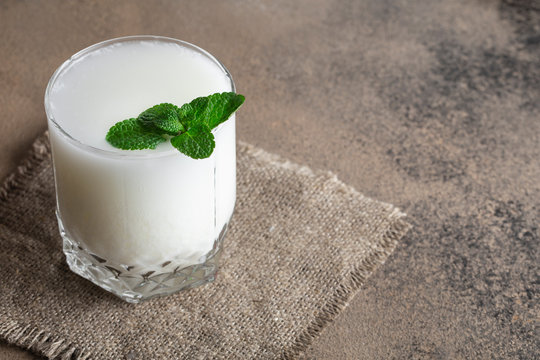 ayran with mint in a glass on the table fermented milk drink
