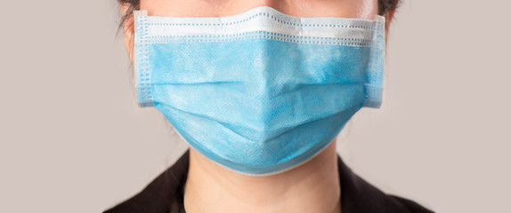 Woman wearing face mask because of air pollution