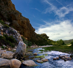Mountain landscapes with river rocks and vegetation