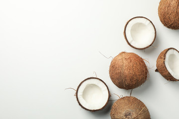 Fototapeta na wymiar Flat lay with coconut on white background, top view