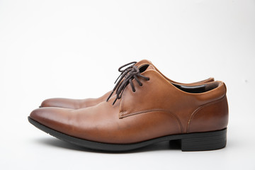 Brown leather shoes isolated on white background.