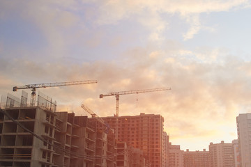 Fototapeta na wymiar Industrial construction cranes the construction of an building