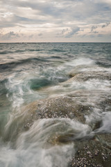 Long exposure sea and rocks at twilight