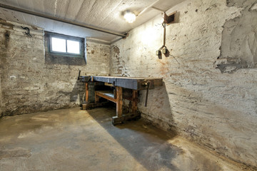 Fototapeta na wymiar Abandoned empty old dark underground cellar