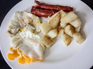 A white plate topped with different types of food