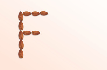 Letter F of the English alphabet from nuts. Food pattern made from nuts alphabet for shop and diet