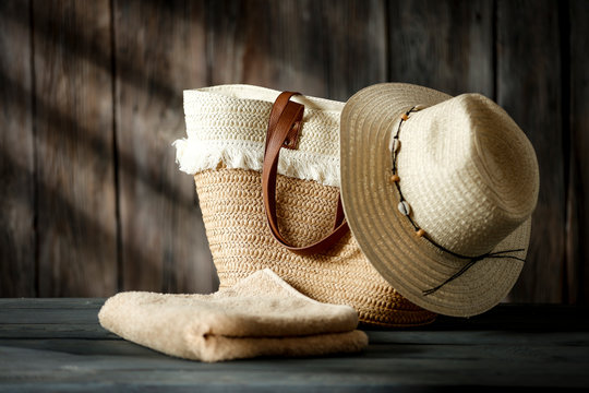 Summer background of free space for your decoration and bag with hat on board. 