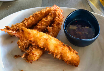 finger fish on a plate with sauce