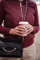 young woman holding a cup of coffee