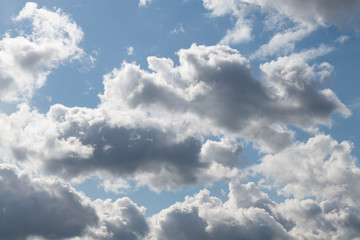 Fototapeta na wymiar Backlit clouds on blue sky