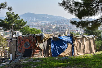 Homeless shack of garbage on the background of the Turkish city of Bodrum
