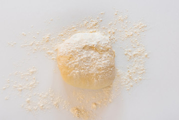 Handmade dough for bread on a white marble background, homemade cooking.