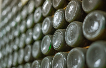 Wine bottle background. Old Wine Bottles in a wine vault.