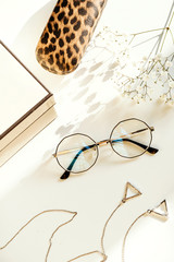 Stylish women's glasses and accessories. Optics store, eye health care.