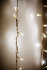 White electric garland. Holiday lights. Beautiful background with LED garland at night