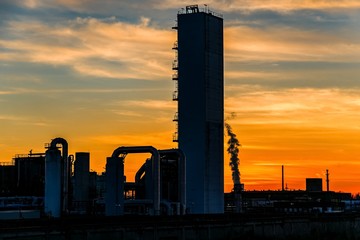 Fototapeta na wymiar Black silhouette factory at sunset