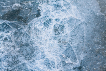 Blue ice. Dark ice with a crack. Broken ice texture