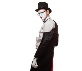 Portrait of a male mime artist performing, isolated on white background. Takes off his jacket. Symbol of seduction, charm, flirting, fascination
