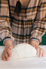 Obraz na płótnie Canvas Woman prepares to her home handmade dough for bread, homemade cooking.