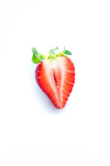 One cut fresh strawberry were placed on a white background. Copy space