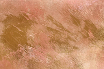 Fototapeta premium Peachy texture with gold paint leaks and stains. Craft Background.