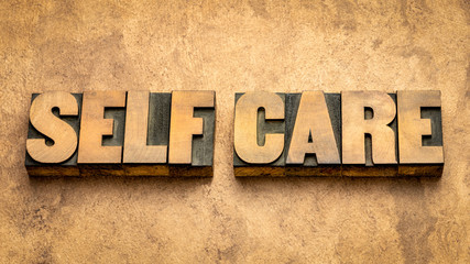 self care word abstract tin wood type