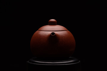 Chinese teapot on a black background