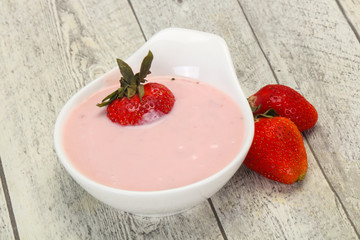 Yoghurt with strawberry in the bowl