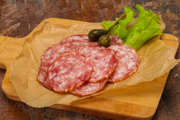 Fototapeta premium Spanish Salchichon sausage with salad