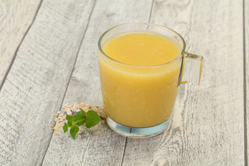 Dietary vegetarian oats milk over wooden