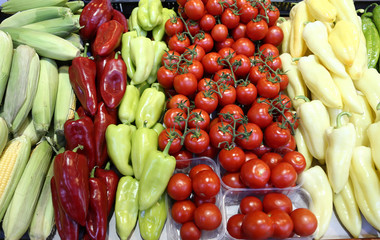 Pile of colorful fresh peppers paprika and tomatoes