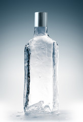 Bottle form, with closure, made from clean, transparent ice. Purity and freshness concept.