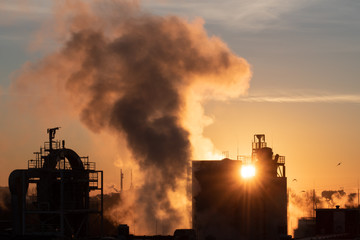 smoke from the chimney at sunset