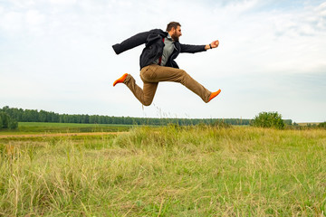 a man with a beard running high above the ground almost flies