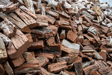 Pile of chopped wood tree trunks