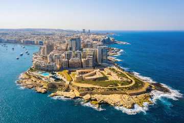 Aerial top view of Tigne Point apartment in Sliema city. Malta island. Sunny day, blue clear sky, Mediterranean sea