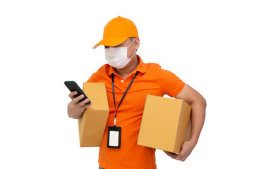 Delivery man holding parcel box and mobile phone and wearing protective mask for prevent virus Covid-19 isolated on white background, Online shopping shipping and fast express delivery service concept